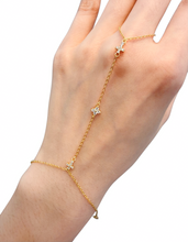 Load image into Gallery viewer, Gold hand chain bracelet with crystal cross accents and delicate chain
