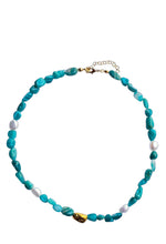 Load image into Gallery viewer, Handcrafted blue agate necklace with natural blue gemstone nuggets, freshwater pearls, and gold-plated stainless steel accents.
