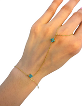 Load image into Gallery viewer, Gold hand chain bracelet with turquoise flower details and delicate chain
