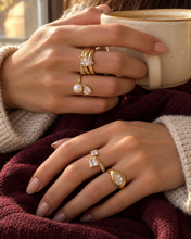 Load image into Gallery viewer, Amara gold-plated stainless steel stackable ring set with pear-cut and pavé clear crystals.
