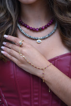 Load image into Gallery viewer, Rosé gold-plated hand chain bracelet with pink crystal accents and finger loop
